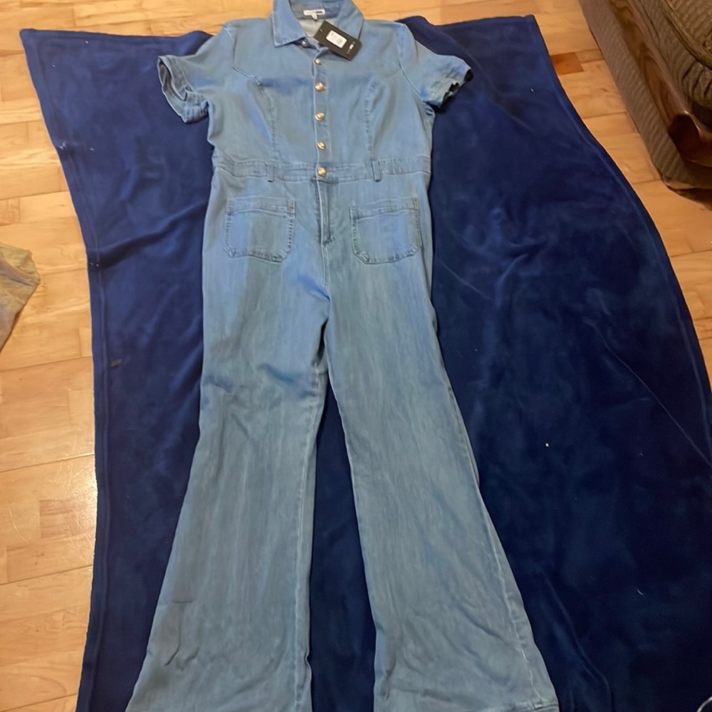 Light Blue denim jean bell bottom jumpsuit from Fashion Nova.